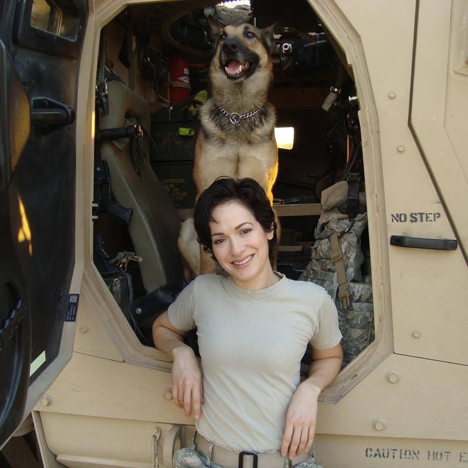 Jess J. Montgomery with a working dog during her Army service
